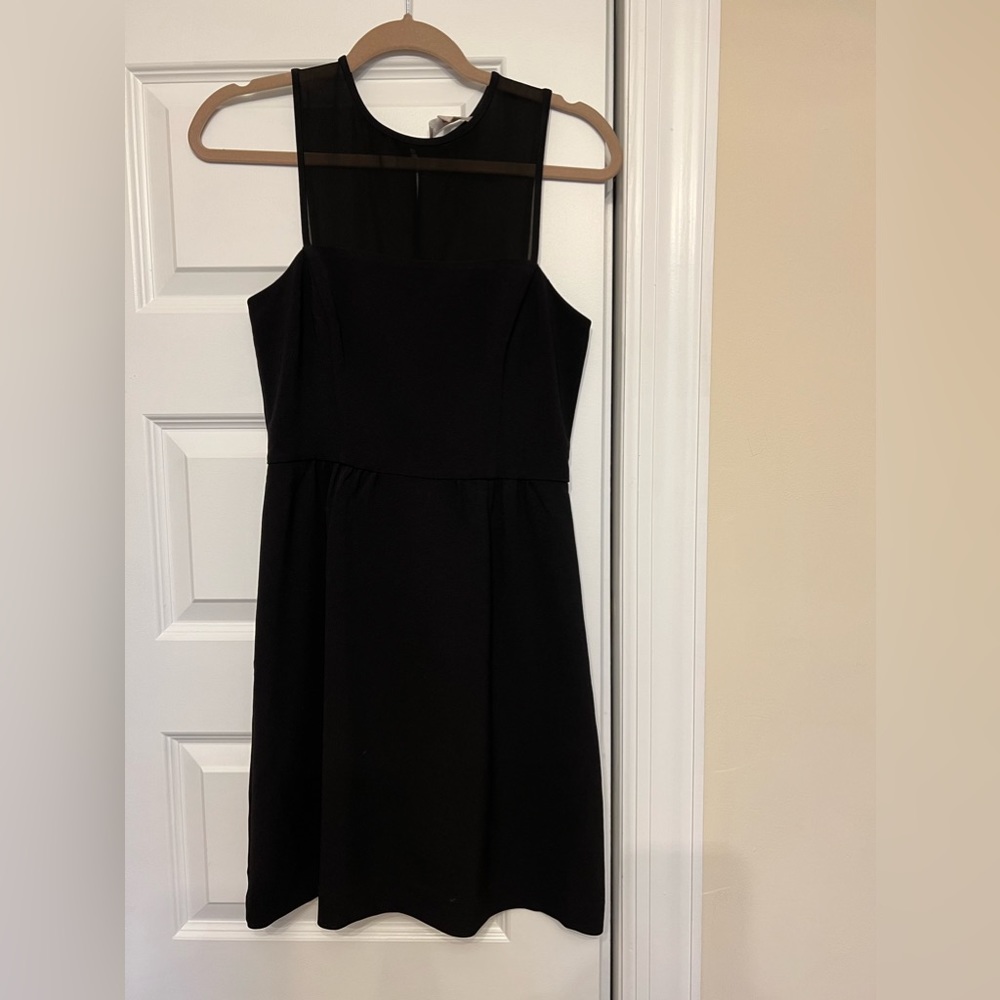 Black cocktail dress with mesh panel